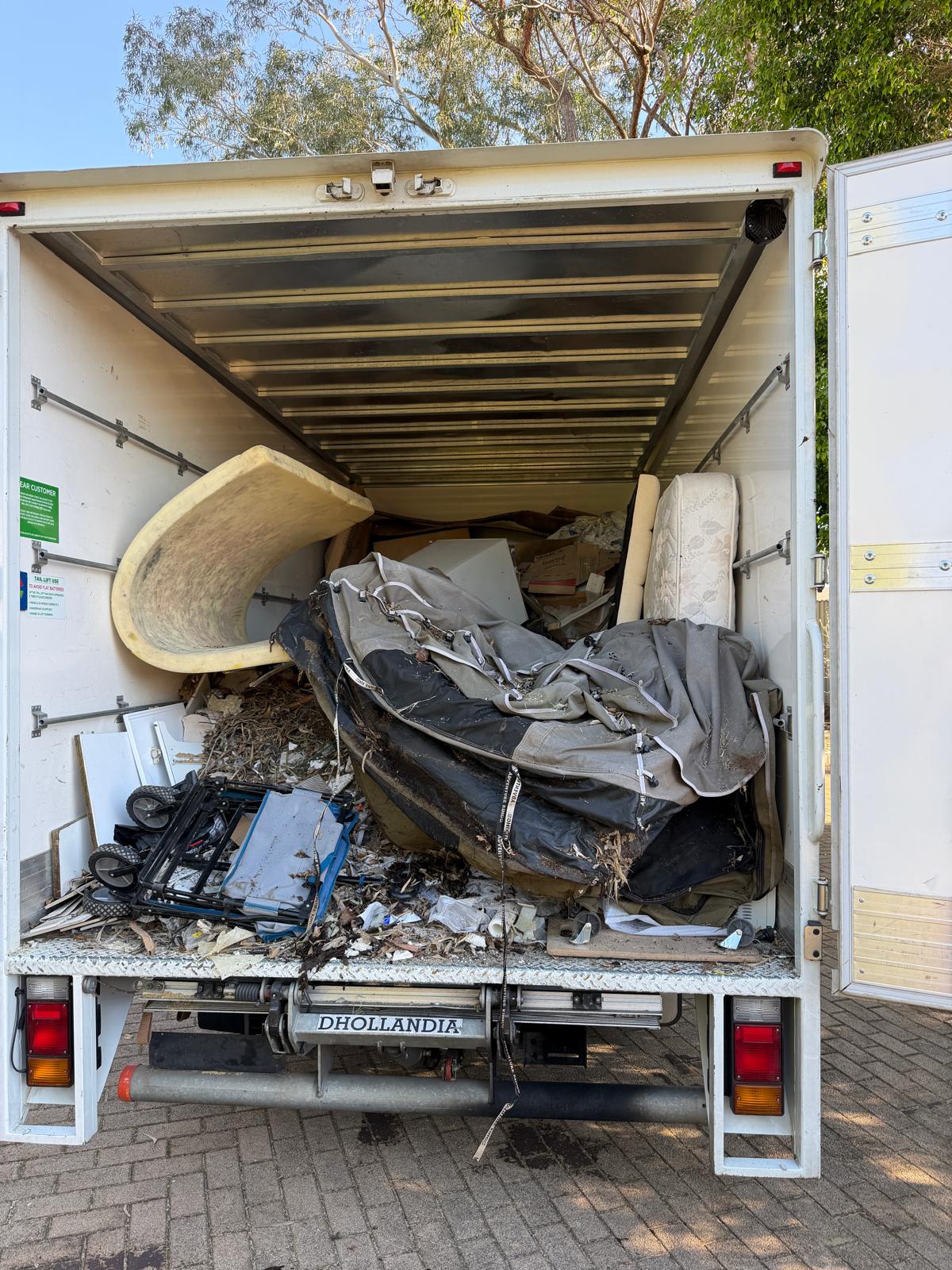 Truck loaded with furniture, mattresses and camping gear in Perth