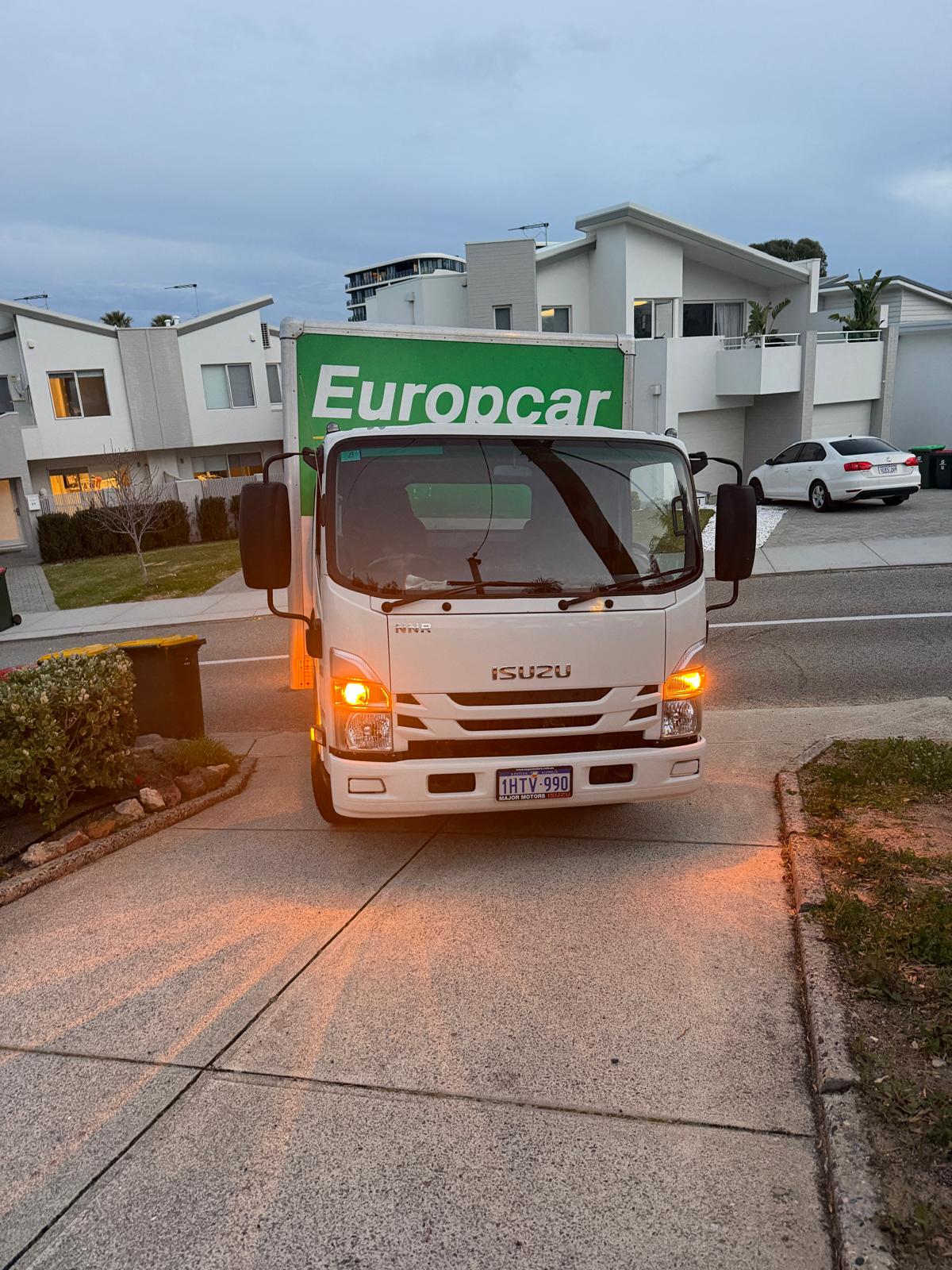 Our Real Perth Isuzu Rubbish Removal Truck servicing residential driveway